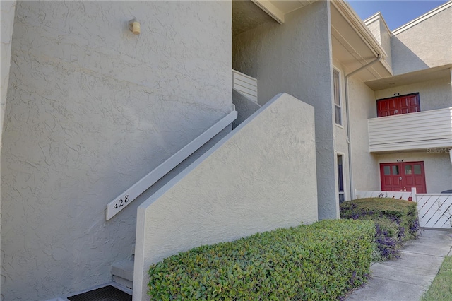 view of side of home with a balcony