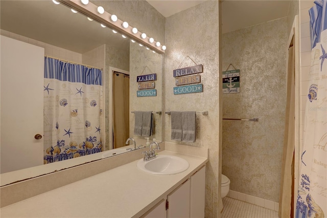 bathroom featuring toilet, curtained shower, vanity, and tile patterned floors