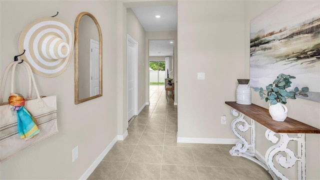 corridor featuring light tile patterned floors