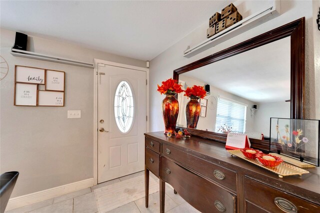 foyer entrance with light tile patterned floors