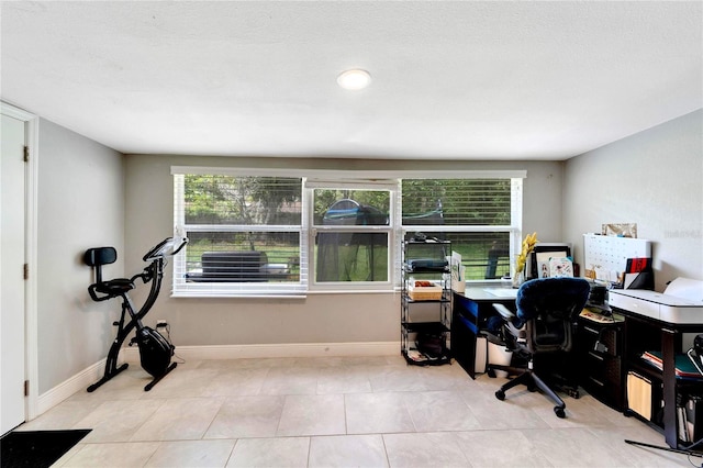 office space with light tile patterned floors and a wealth of natural light