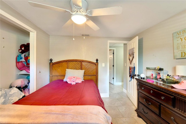 bedroom with light tile patterned floors and ceiling fan