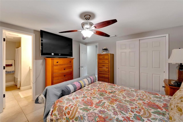 bedroom featuring a closet, ceiling fan, and light tile patterned floors