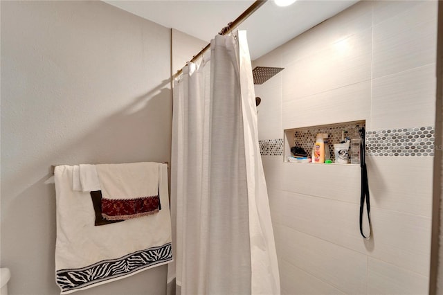 bathroom featuring curtained shower