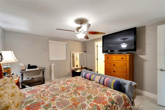 tiled bedroom with ceiling fan