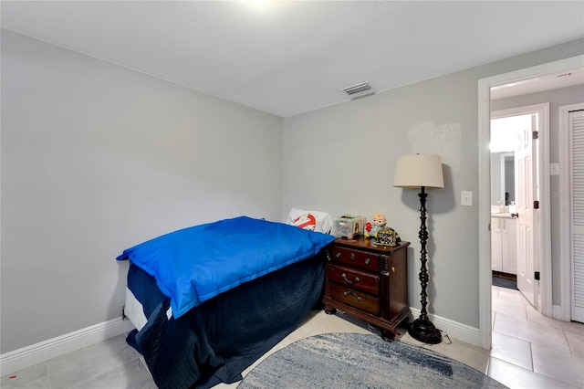 bedroom featuring light tile patterned floors