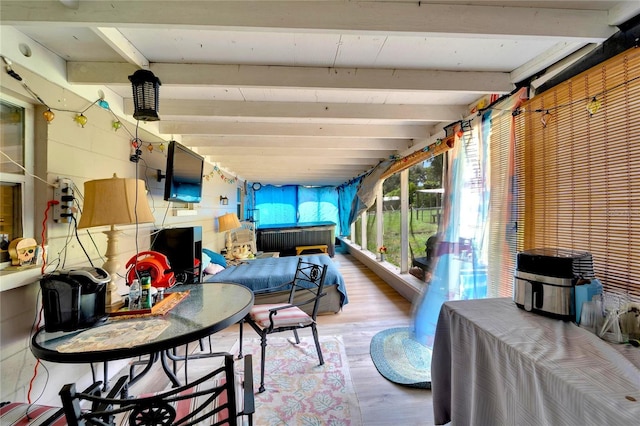 sunroom with beamed ceiling