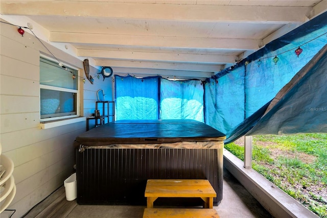 sunroom with beamed ceiling