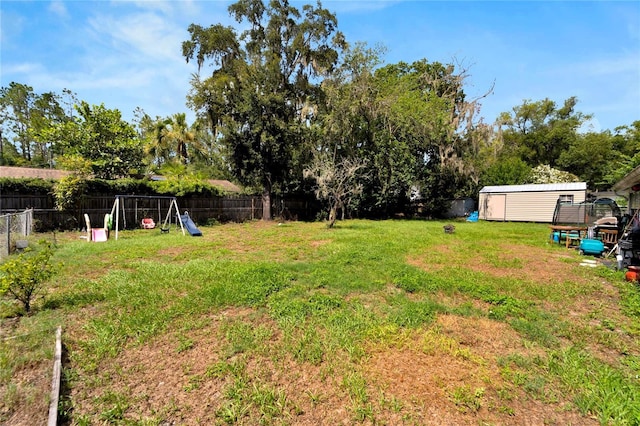 view of yard with a storage unit