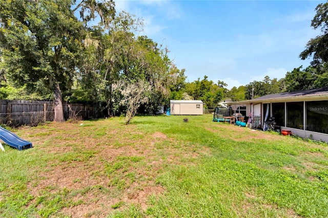 view of yard with a storage shed