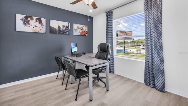 office space with light wood-type flooring and ceiling fan