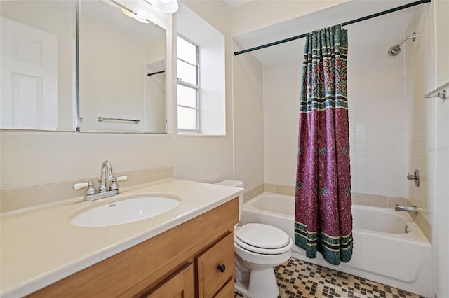 full bathroom featuring tiled shower / bath, vanity, and toilet