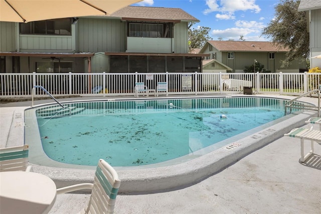 view of swimming pool featuring a patio area