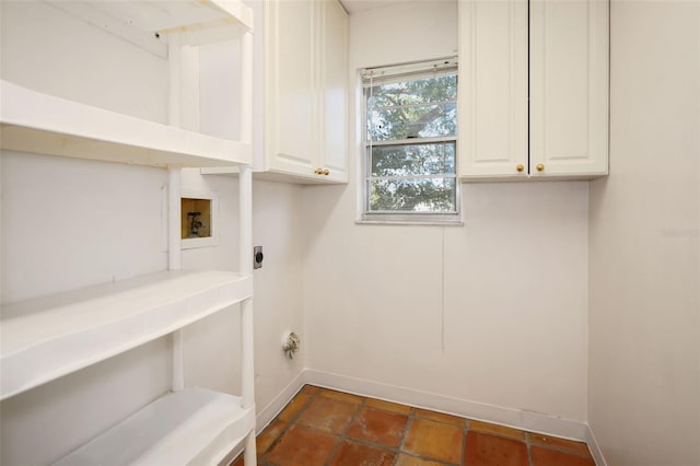 laundry area featuring hookup for a washing machine, cabinets, and hookup for an electric dryer