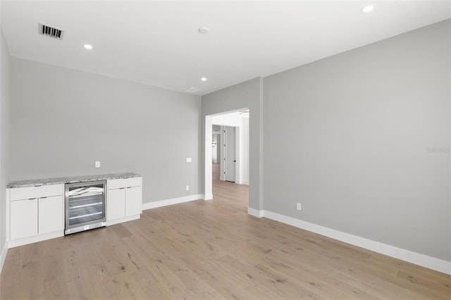 1810 4th St E, Palmetto, FL 34221 - indoor dry bar featuring beverage cooler, light wood-style floors, baseboards, and recessed lighting