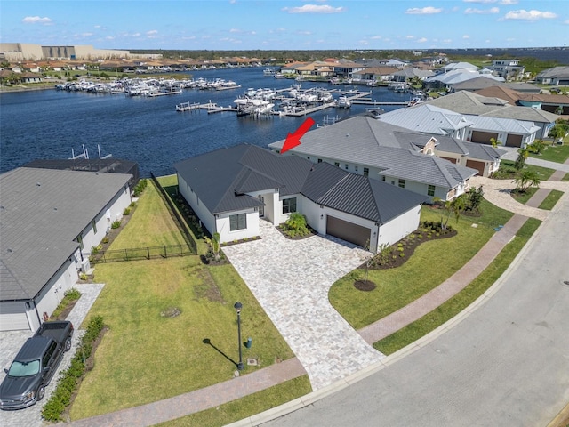 birds eye view of property with a water view