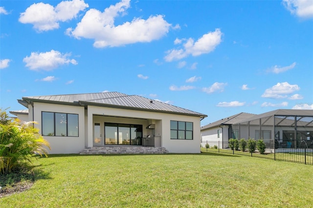 1810 4th St E, Palmetto, FL 34221 - rear view of property featuring stucco siding, metal roof, a standing seam roof, and a lanai