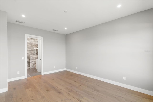 1810 4th St E, Palmetto, FL 34221 - spare room featuring light wood-style flooring, baseboards, and recessed lighting