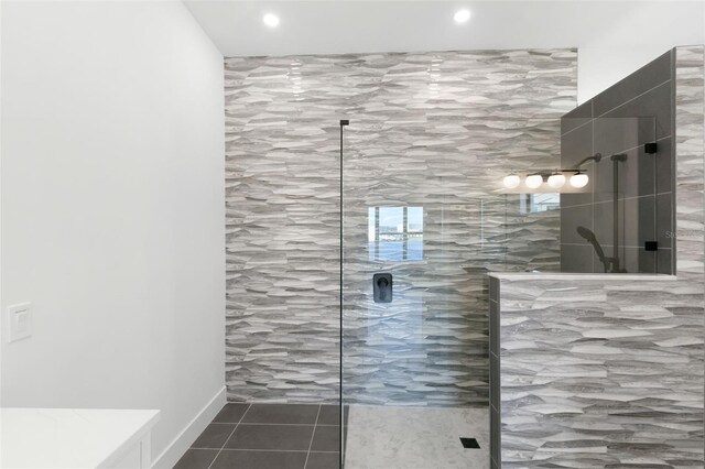 1810 4th St E, Palmetto, FL 34221 - full bath featuring a walk in shower, tile patterned flooring, recessed lighting, and tile walls