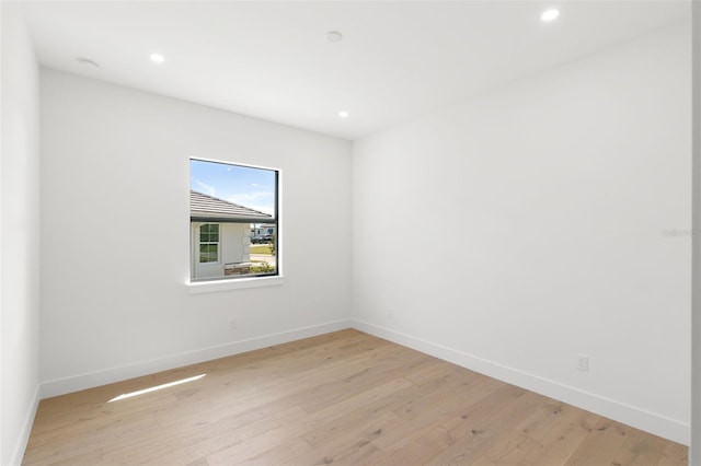 spare room featuring light hardwood / wood-style flooring