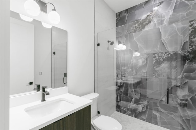 1810 4th St E, Palmetto, FL 34221 - bathroom with vanity, toilet, and a marble finish shower