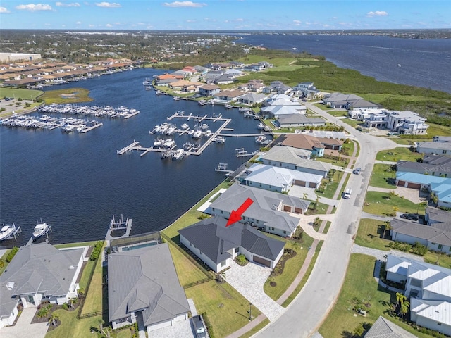 birds eye view of property featuring a water view