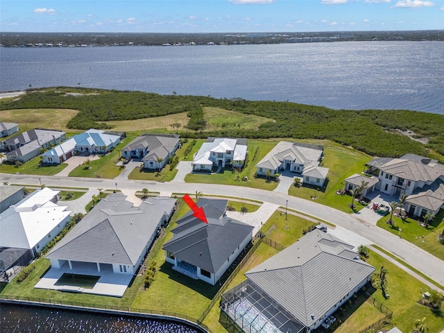 birds eye view of property featuring a water view