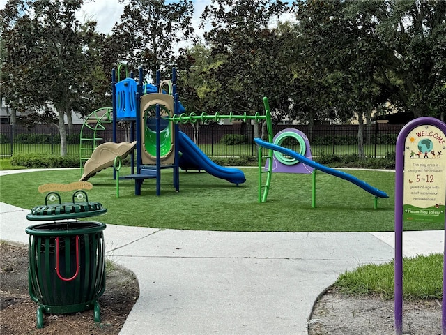 view of playground featuring a lawn