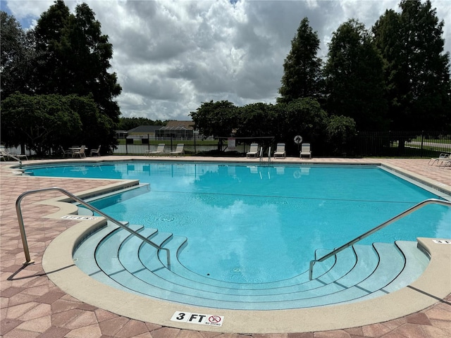 view of swimming pool featuring a patio