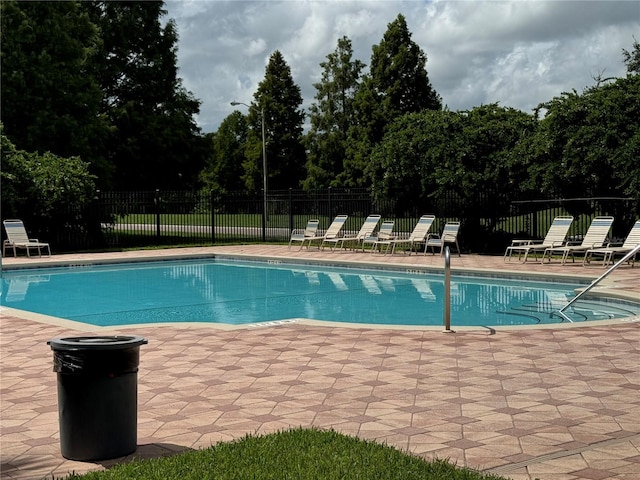 view of swimming pool featuring a patio