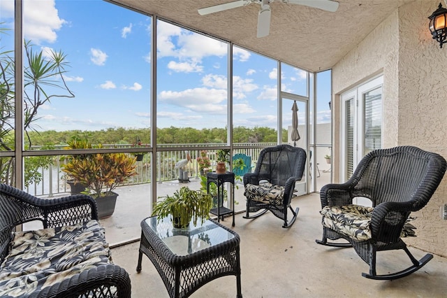 sunroom featuring ceiling fan