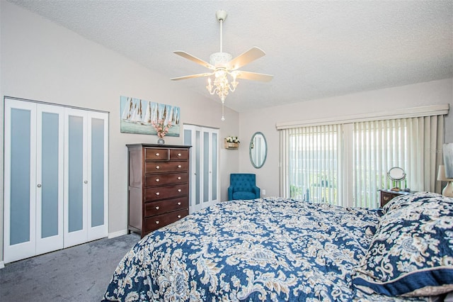 carpeted bedroom featuring ceiling fan, a textured ceiling, and lofted ceiling