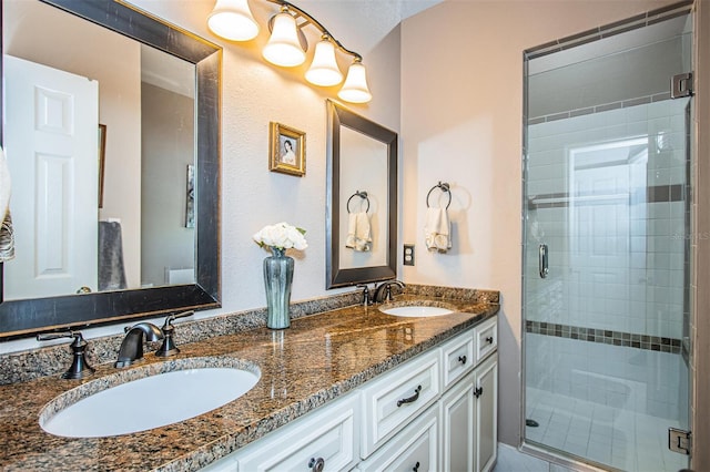 bathroom featuring vanity and a shower with shower door