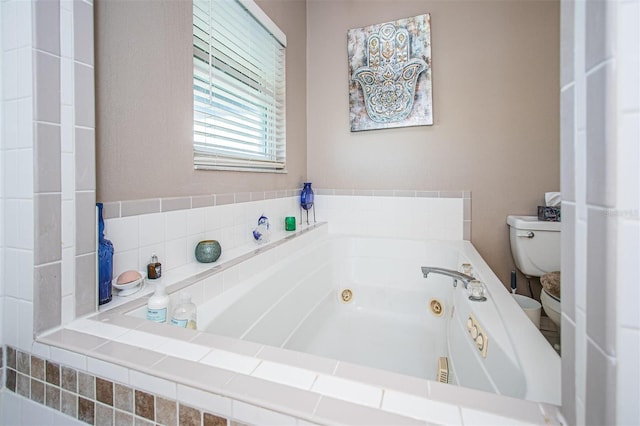 bathroom featuring toilet and tiled bath