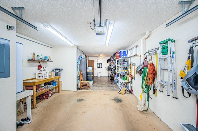 garage with a garage door opener and a workshop area