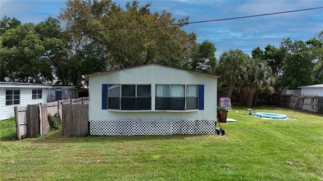 view of home's exterior featuring a lawn