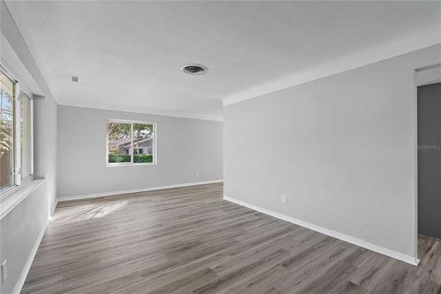 empty room with light hardwood / wood-style floors