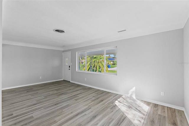 spare room with light wood-type flooring