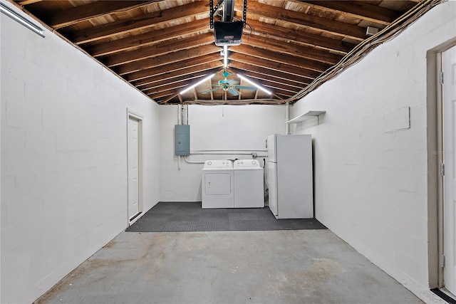 basement with electric panel, independent washer and dryer, and white refrigerator