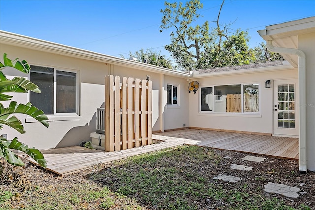 entrance to property with a wooden deck