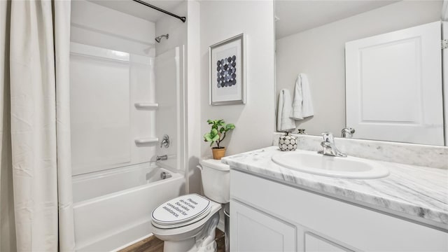 full bathroom featuring wood-type flooring, shower / bath combination with curtain, vanity, and toilet