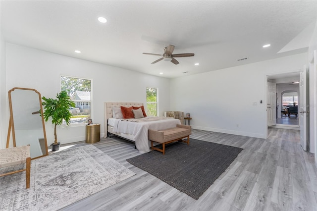 bedroom with light wood-type flooring and ceiling fan