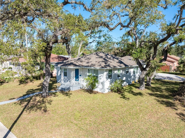 ranch-style house with a front lawn