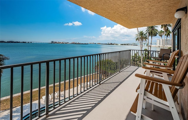 balcony featuring a water view