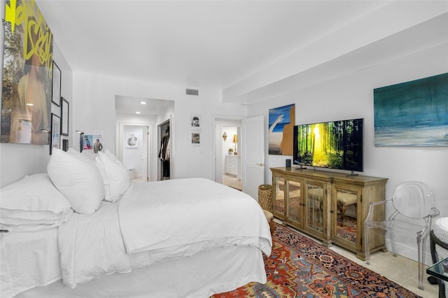 bedroom featuring light tile patterned floors