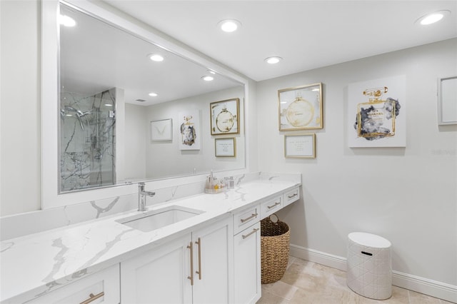 bathroom with vanity, an enclosed shower, and tile patterned flooring