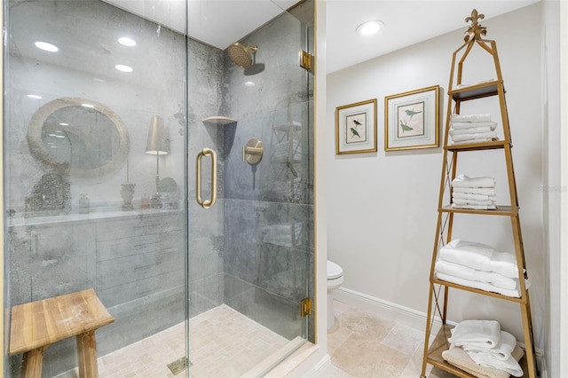 bathroom featuring toilet and an enclosed shower