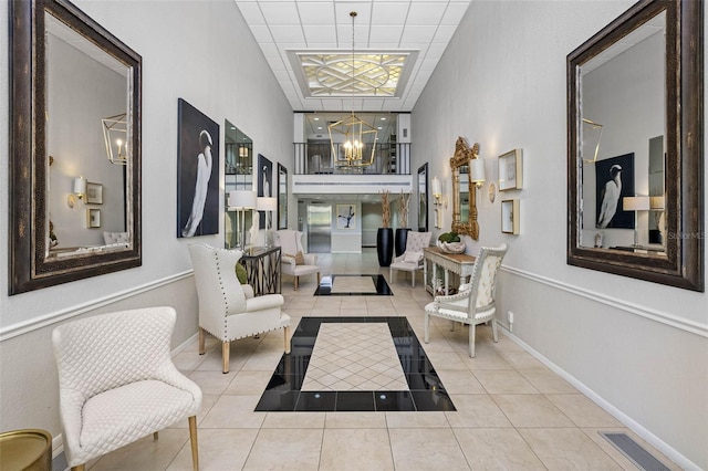 corridor featuring a notable chandelier and light tile patterned floors