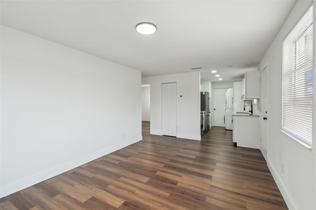 interior space with dark wood-type flooring and sink