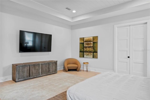 bedroom with hardwood / wood-style floors